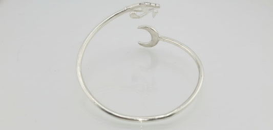 “Sterling silver Horus eye cuff bracelet — back view showing crescent moon detail.”