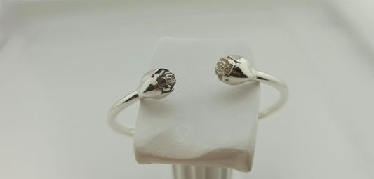 “Rosebud silver cuff bracelet in 925 sterling silver, floral blossom design shown on wrist.”