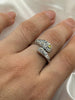 Adjustable sterling silver floral ring with yellow zircon shown on hand