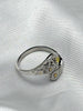 Side view of adjustable sterling silver floral ring with yellow zircon and sculpted flower details