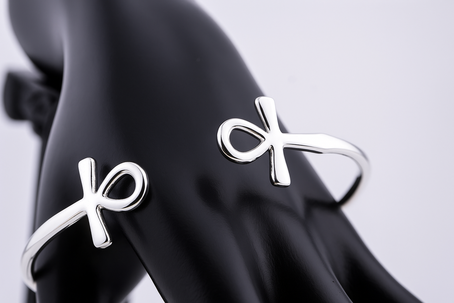 “925 sterling silver Ankh cuff bracelet on a black mannequin hand”