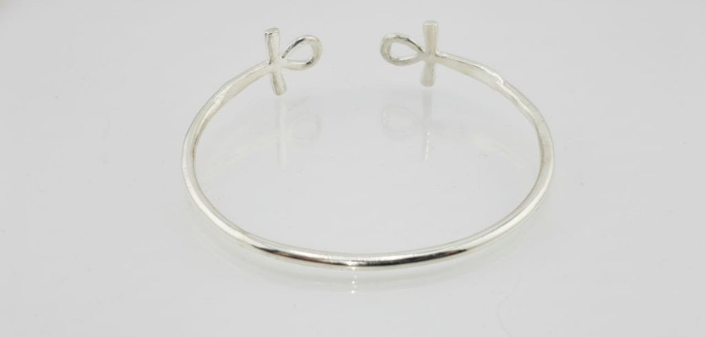 “Sterling silver Ankh open cuff bracelet on a white background”
