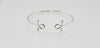 “Sterling silver Ankh cuff bracelet on a white background”