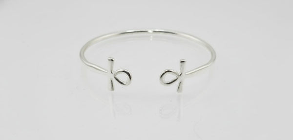 “Sterling silver Ankh cuff bracelet on a white background”