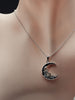 Crescent moon rose 925 sterling silver necklace displayed on a jewelry bust.