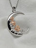 925 sterling silver crescent moon necklace with warm-toned sculpted roses and silver leaf details.