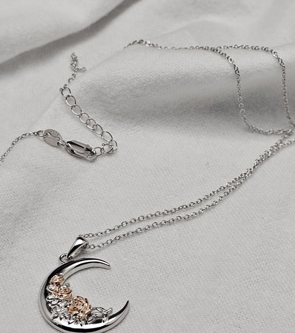 925 sterling silver crescent moon rose necklace with chain, clasp, and extension links.