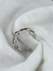 Side profile of Flowing Circle adjustable sterling silver ring showing its thickness and open design