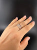 Sterling silver flowing circle ring worn on hand, showing its openwork design and adjustable fit