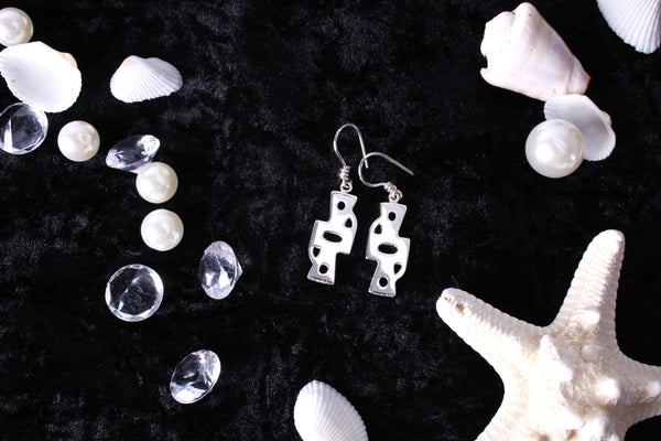 Sterling silver Gye Nyame symbol earrings with Adinkra design styled with shells and pearls