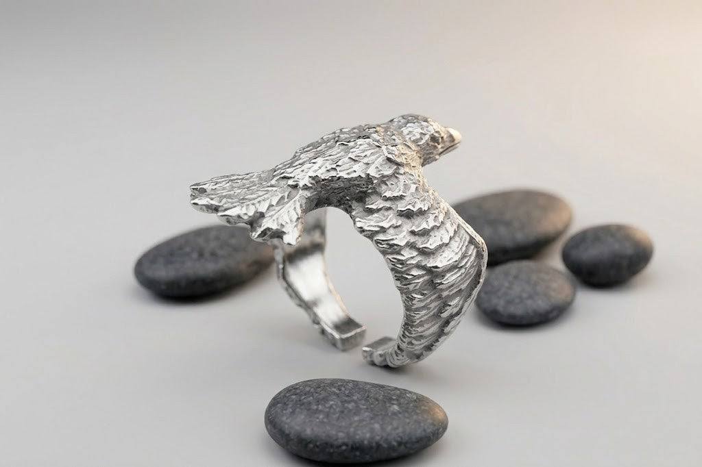 Massive silver ring featuring an image of a raven, weighing 8 grams. Smooth inner polish and detailed feathers. A gift with deep meaning for him and for her