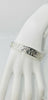 "Royal silver cuff bracelet with floral flower and leaf design shown on a white mannequin hand against a clean white background — luxury sterling silver jewelry."