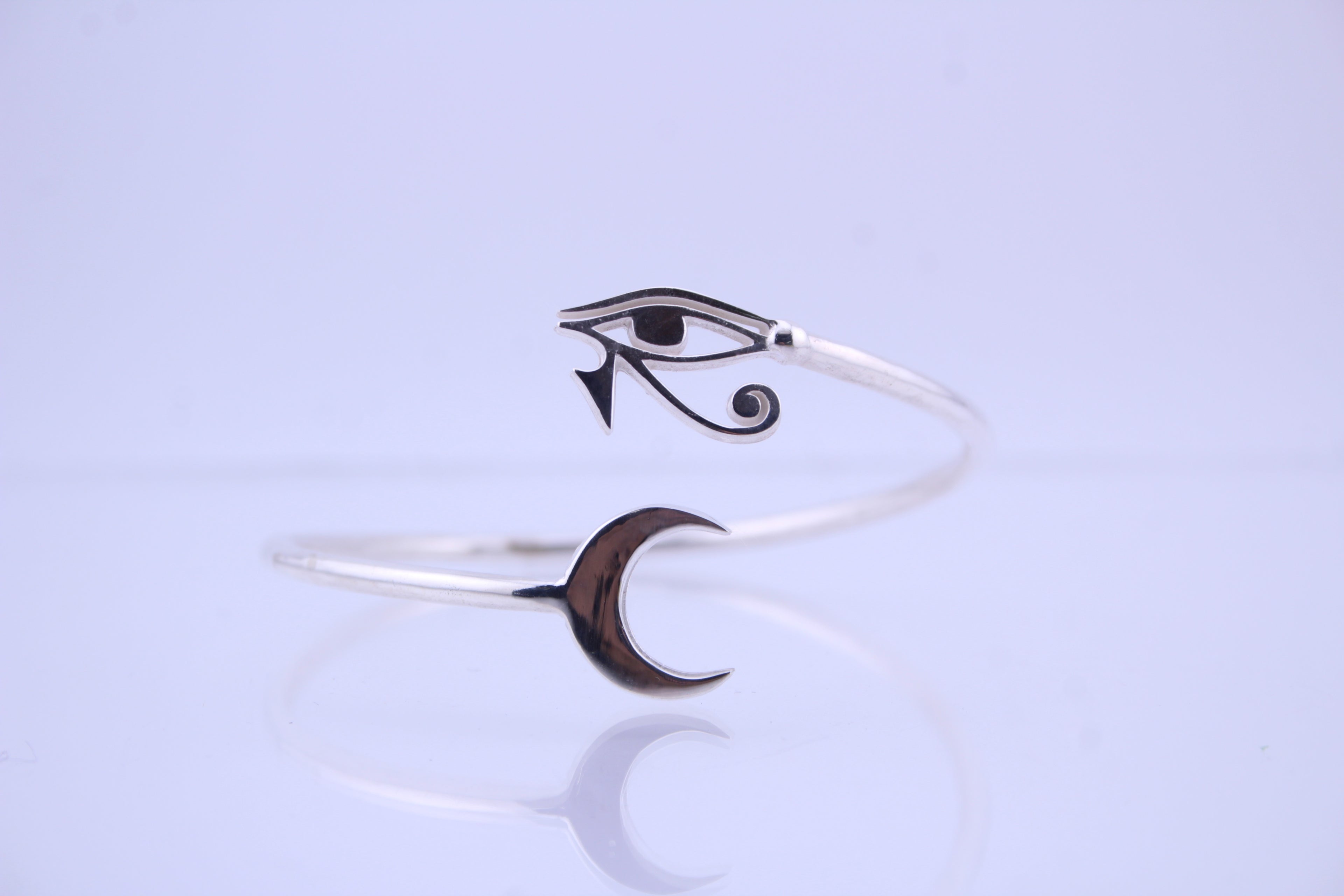 front view of 925 sterling silver eye of horus moon bracelet — sun and moon jewelry
side view silver egyptian moon cuff bracelet — horus design
925 silver horus bracelet with moon charm — egyptian jewelry
minimalist silver moon cuff with horus symbol — sterling silver bracelet
