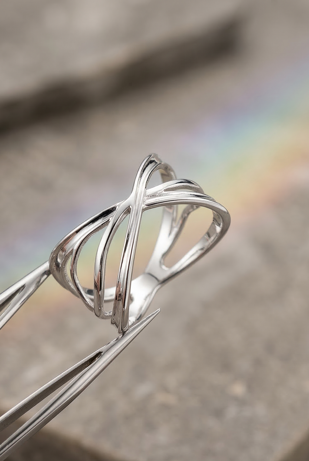 Close-up of mirror-polished silver ring, realistic metallic glow, precision 3D printed jewelry.