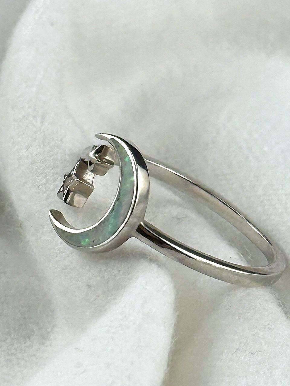 Side view of sterling silver crescent moon and stars ring with opal inlay