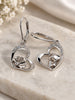 Sterling silver heart earrings with rose and masquerade mask details and sparkling stone accents