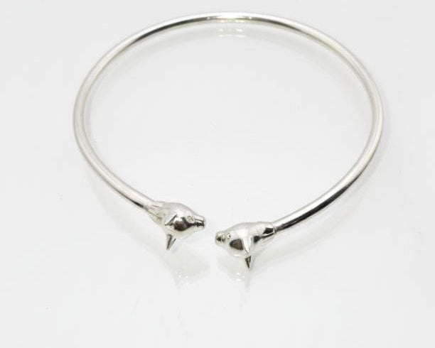 “Silver Cat Bracelet – top view of 925 sterling silver open cuff with twin cat head details on a clean white background”