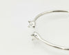 “Silver Cat Bracelet – angled view of 925 sterling silver open cuff with twin cat head tips on a white background”
