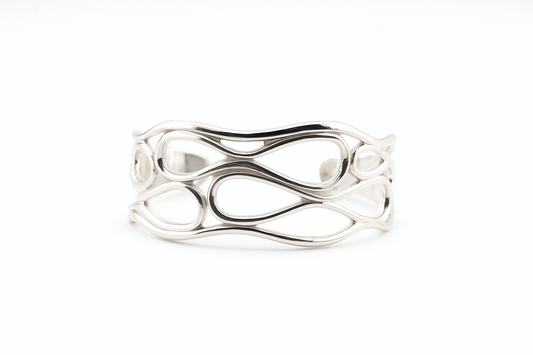 Silver infinity wave cuff bracelet on a clean white background.