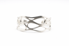 Silver infinity wave cuff bracelet on a clean white background.