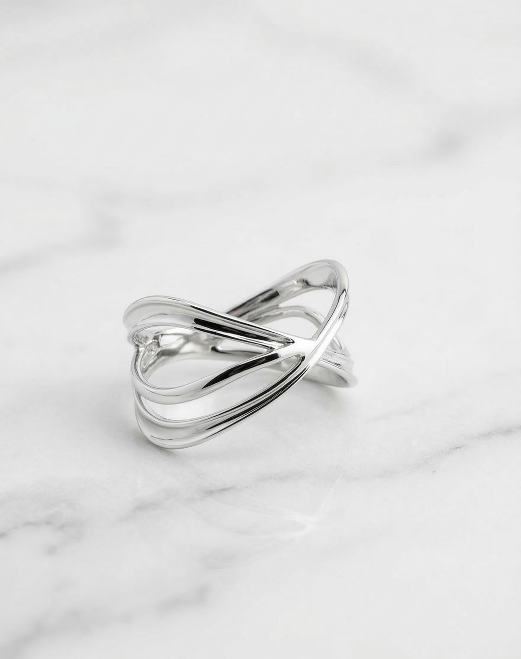 Minimalist 925 sterling silver ring with intertwined bands, high-polish finish, Lakseena jewelry.