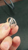 Wide 18mm silver statement ring on finger, modern destiny thread design, handcrafted jewelry.