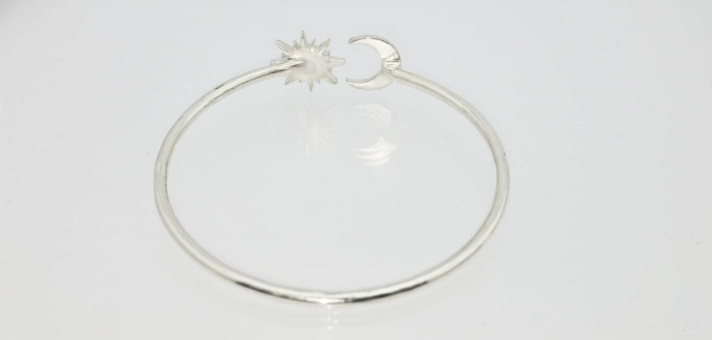 “925 sterling silver moon and sun cuff bracelet rear view on a white background.”