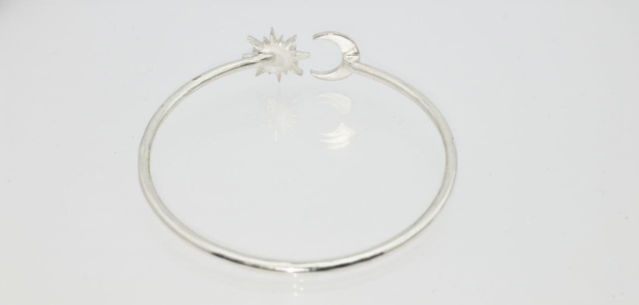 “925 sterling silver moon and sun cuff bracelet rear view on a white background.”