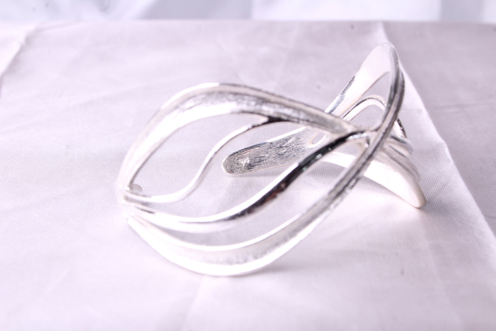 Top view of 30 grams sterling silver Wave cuff showing the organic curves and mirror polished edges