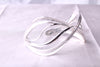 Top view of 30 grams sterling silver Wave cuff showing the organic curves and mirror polished edges
